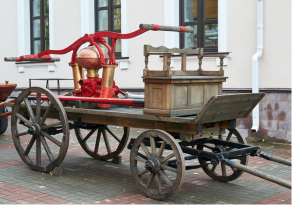 Wooden retro fire truck with a hand pump