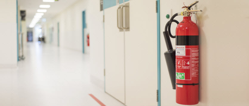 Fire Extinguisher placed on the wall of the hospital hallway