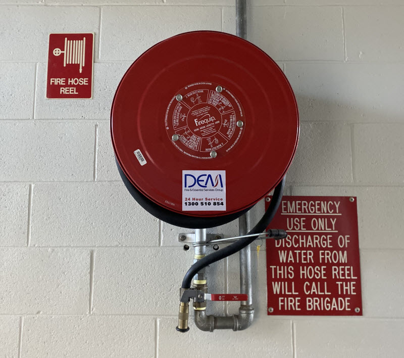 Fire hose installed in a building